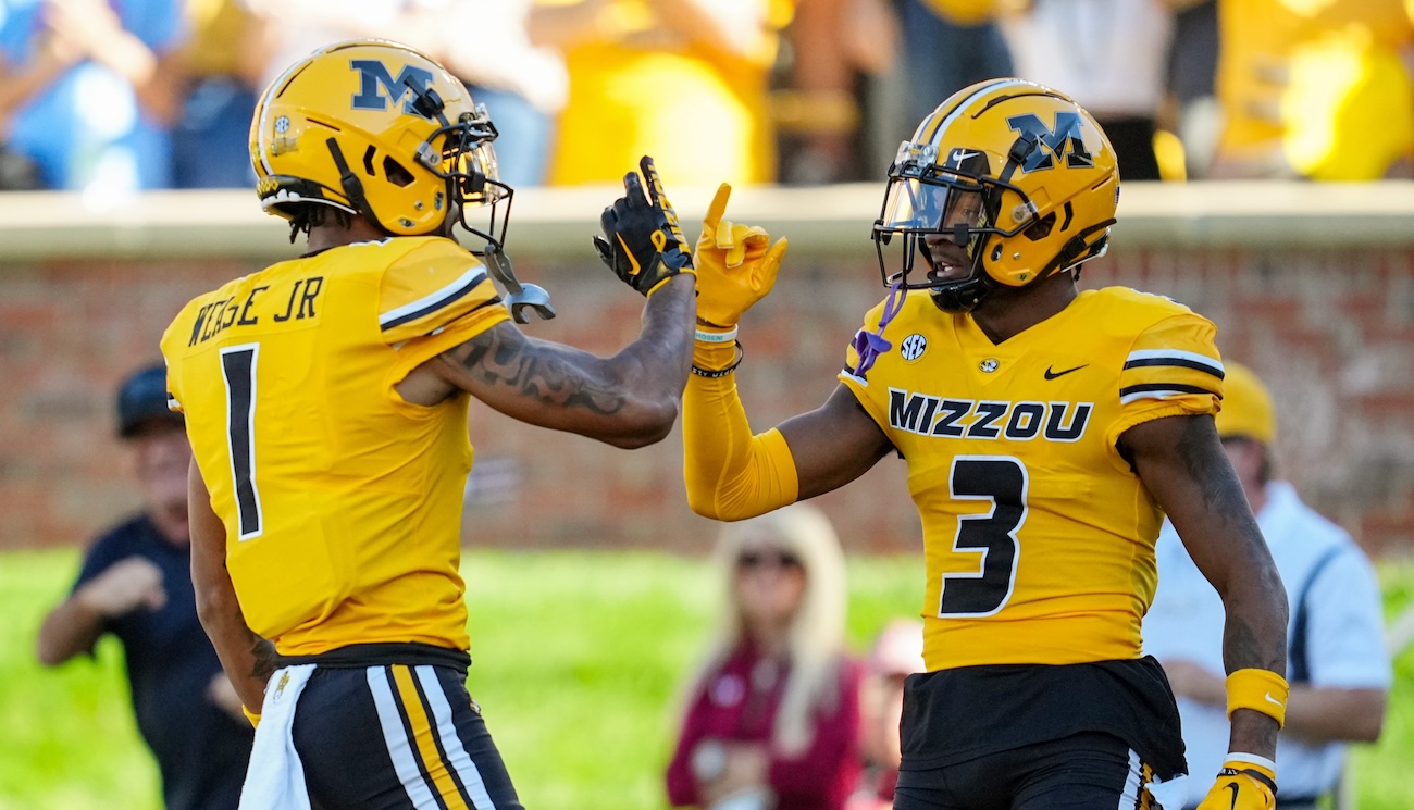 Luther Burden III and Theo Wease Jr. of the Missouri Tigers celebrate after scoring a touchdown against South Carolina during the 2023 college football season.