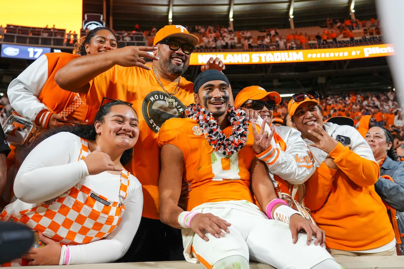 Tennessee QB Nico Iamaleava celebrates with his family after a win over Florida.